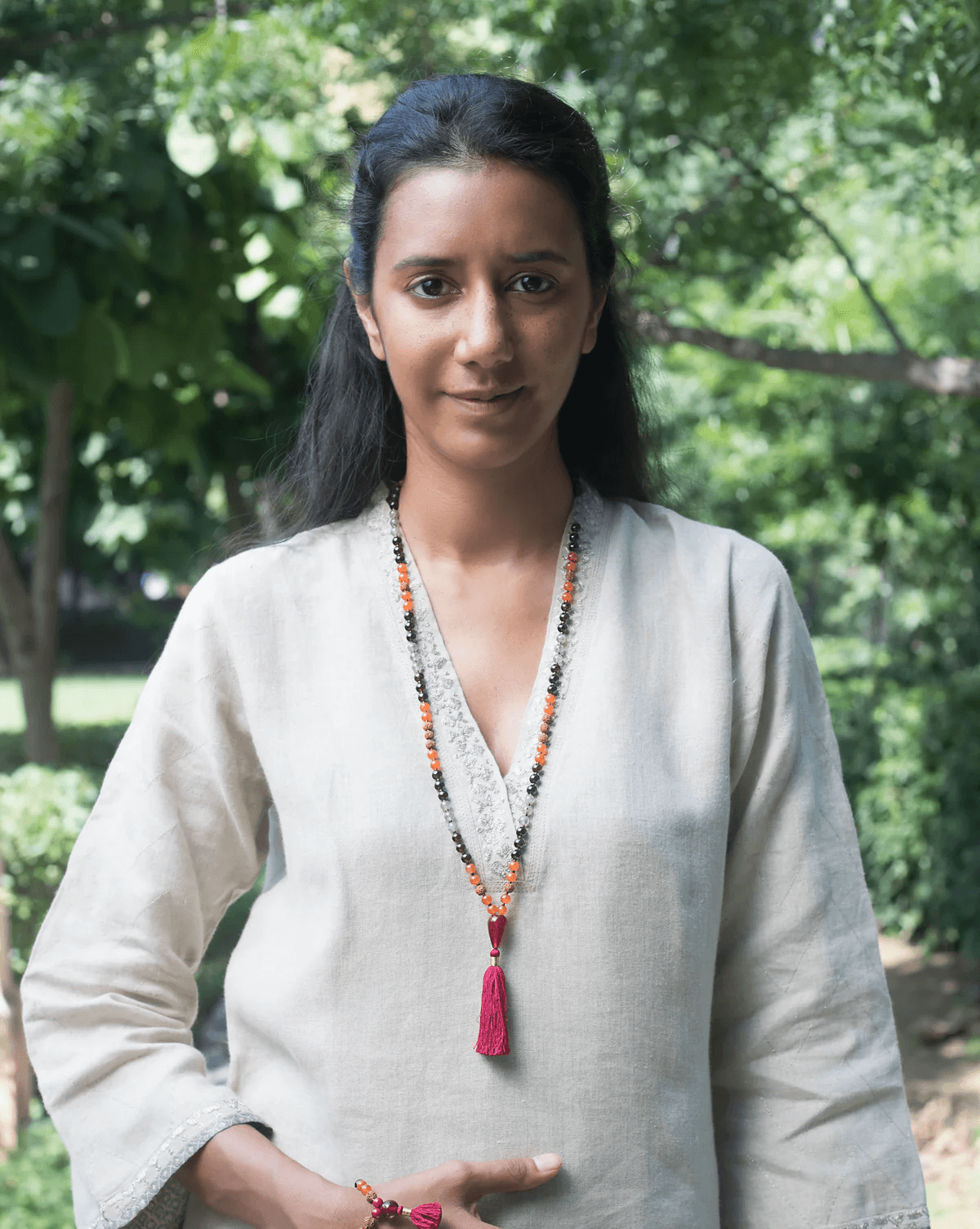Piya Jain, Founder of Maha Mala, wearing a sacred mala necklace